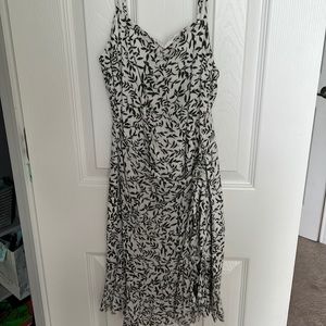 Size 4 Princess Polly tie dress, pattern is leaves with a off white background